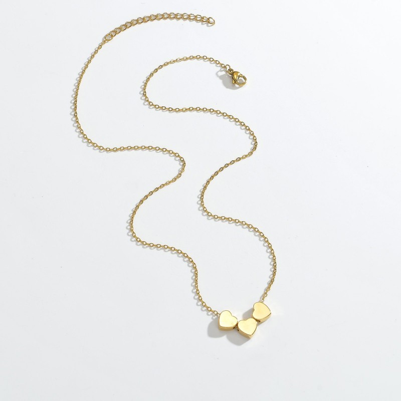 Minimalist Sleek Stainless Steel Pierced Heart Necklace With A Niche Designer Aesthetic For Women